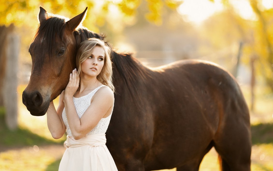 [Immagine: 8328_Pretty-blonde-girl-and-a-brown-horse.jpg]